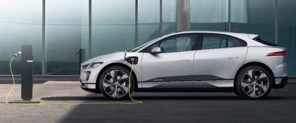 An electric car plugged into a charge point