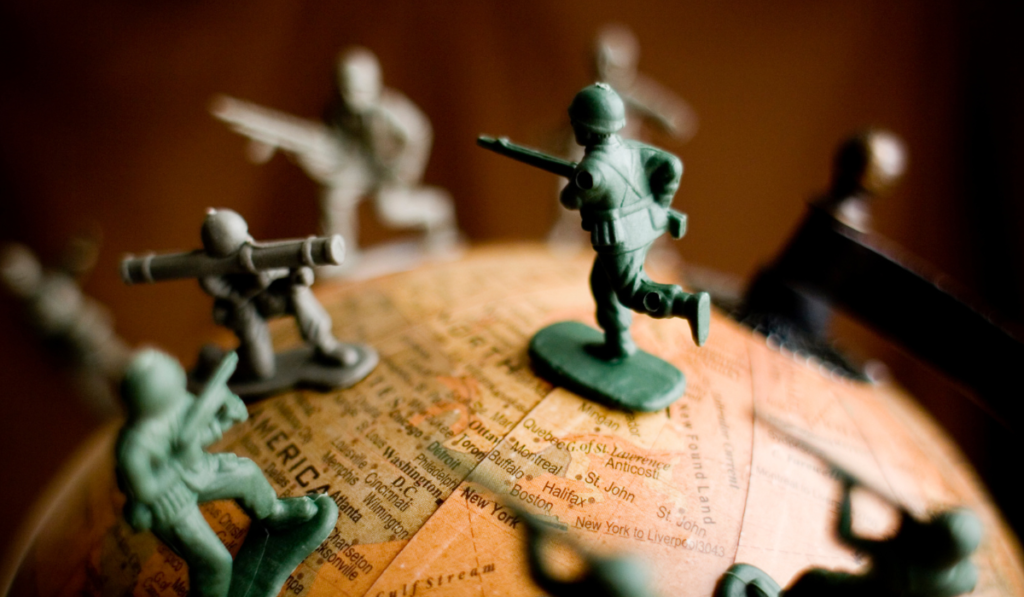 Plastic soldier figures on a globe