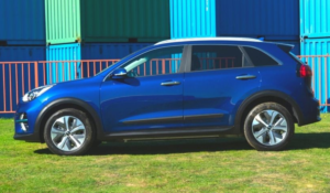 A blue kia e-niro facing left