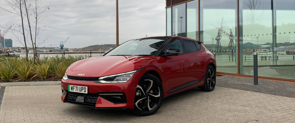 Kia EV6 in front of window